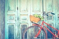 Hipster red bicycle in old building walls background Royalty Free Stock Photo