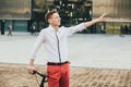 Hipster with red bycicle and tattoo on leg Royalty Free Stock Photo