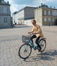 hipster riding bicycle in Copenhagen