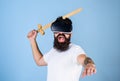 Hipster on shouting face enjoy play game in virtual reality. VR gamer concept. Guy with head mounted display and sword