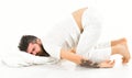 Hipster with sleepy face lies on pillow, sleeps like baby. Royalty Free Stock Photo