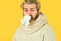 Hipster sneezing and blow out nose. Allergy reaction. inflammatory process. sick man has runny nose. flu and virus Royalty Free Stock Photo