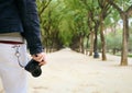 Hipster Street Photographer Walking With Mirrorless Camera In Hand