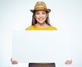 Hipster style girl holding big white sign board. Royalty Free Stock Photo