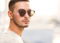 Hipster style guy. Fashion man standing near black wall Royalty Free Stock Photo