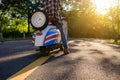 Hipster style person tour by motorcycle on the center road and y