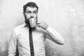 Hipster with surprised face drink tea from coffee cup Royalty Free Stock Photo