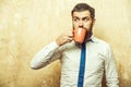 Hipster with surprised face drink tea from coffee cup Royalty Free Stock Photo