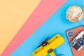 Hipster travel blogger accessories flatlay on blue yellow