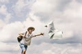 Hipster traveler on top of mountains with amazing sky clouds vie Royalty Free Stock Photo