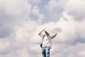 Hipster traveler on top of mountains with amazing sky clouds vie Royalty Free Stock Photo