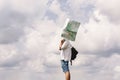 Hipster traveler on top of mountains with amazing sky clouds vie Royalty Free Stock Photo