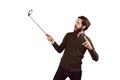 Hipster using his seflie stick Royalty Free Stock Photo