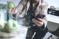 hipster using smart phone and digital tablet computer and holding credit card payments online business,sitting on sofa in living