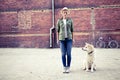 Hipster woman with dog and vintage road bike in city Royalty Free Stock Photo