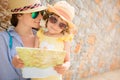 Hipster woman and girl in summer city