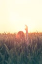 Hipster woman greets the sun in the sign of freedom