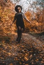 Hipster woman portrait, autumn park, beautiful golden nature. Lifestyle, hat.