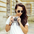 Hipster woman with retro film camera outdoor fashion portrait Royalty Free Stock Photo