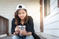 Hipster woman taking photos with retro film camera on wooden floorof city park,beautiful girl photographed in the old camera Royalty Free Stock Photo