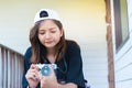 Hipster woman taking photos with retro film camera on wooden floorof city park,beautiful girl photographed in the old camera Royalty Free Stock Photo