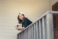 Hipster woman taking photos with retro film camera on wooden floorof city park,beautiful girl photographed in the old camera Royalty Free Stock Photo