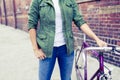 Hipster woman with vintage road bike in city Royalty Free Stock Photo