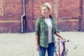 Hipster woman with vintage road bike in city Royalty Free Stock Photo