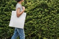 hipster woman with white cotton bag at park Royalty Free Stock Photo