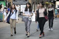 Hipster women dressed in cool Londoner style walking in Brick lane, a street popular among young trendy people Royalty Free Stock Photo