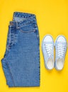 Hipster women sneakers with blue jeans