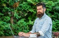 Hipster work online blog with notebook. Blogger create post while enjoy coffee. Create content for web blog. Man bearded