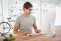 Hipster working on computer at desk Royalty Free Stock Photo