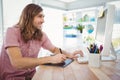 Hipster working on graphics tablet and computer Royalty Free Stock Photo