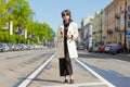 Hipster young girl with backpack enjoying in Central city, traveler Royalty Free Stock Photo