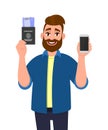 Hipster young man showing passport with tickets and blank screen phone. Trendy bearded person holding boarding pass and mobile, Royalty Free Stock Photo