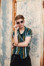 Hipster young stylish man in a fashion beach beautiful shirt