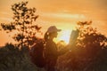 Hipster young Travelers with backpacks enjoying sunset at the mountain Royalty Free Stock Photo