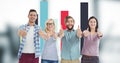 Hipsters gesturing thumbs up while standing against graph Royalty Free Stock Photo