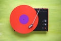 Hipsters retro turntable with red vinyl record Royalty Free Stock Photo