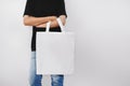 hipter woman holding eco fabric bag isolate on white background Royalty Free Stock Photo