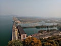 Hirakud Dam is built across the Mahanadi River, about 15 kilometres 9.3 mi from Sambalpur in the state of Odisha in India. Behin