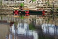 Hire boats on river surface with reflections Royalty Free Stock Photo