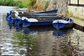 Hire boats on river surface with reflections Royalty Free Stock Photo