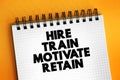 Hire, Train, Motivate and Retain text on notepad, concept background Royalty Free Stock Photo
