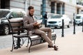 Hired notification. Young happy businessman reads a document. Cash aid, subsidies