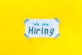 We are hiring - job recruting concept. Words We are hiring on paper banner Royalty Free Stock Photo