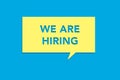 We are hiring message on a yellow sticky note on a blue background