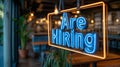 We are hiring neon sign in restaurant window