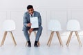 Hiring, recruitment and business man in a waiting room for a corporate company job interview. Happy, smile and confident